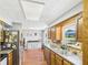 Bright kitchen features a stainless steel fridge and view to the yard from above the stainless steel sink at 4511 W 300 S, Anderson, IN 46011