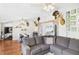 Cozy living room with hardwood floors, a sectional sofa, and deer head decor at 4511 W 300 S, Anderson, IN 46011