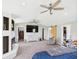 Spacious main bedroom featuring a fireplace, ceiling fan, and ensuite access with a barn door at 4511 W 300 S, Anderson, IN 46011