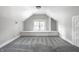 Finished attic space offers flexible use, featuring neutral carpeting and ample natural light at 4904 N Washington Blvd, Indianapolis, IN 46205