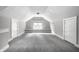 Finished attic space offers flexible use, featuring neutral carpeting and ample natural light at 4904 N Washington Blvd, Indianapolis, IN 46205