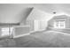 Finished attic space offers flexible use, featuring neutral carpeting and ample natural light at 4904 N Washington Blvd, Indianapolis, IN 46205