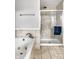 Tiled bathroom showcasing a shower with glass door and a jetted bathtub at 4904 N Washington Blvd, Indianapolis, IN 46205