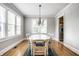 Bright dining room with a large table set, wood floors and a chandelier at 4904 N Washington Blvd, Indianapolis, IN 46205
