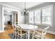 Bright dining room with hardwood floors, chandelier, and access to other rooms at 4904 N Washington Blvd, Indianapolis, IN 46205