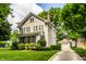 Exterior shot of house featuring a lawn, detached garage, and screened in porch at 4904 N Washington Blvd, Indianapolis, IN 46205