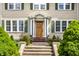 Inviting front entrance with a classic wooden door and manicured shrubs at 4904 N Washington Blvd, Indianapolis, IN 46205