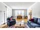 Comfortable living room with hardwood floors, natural light, and classic furnishings at 4904 N Washington Blvd, Indianapolis, IN 46205