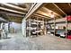 Unfinished basement with open ceiling and concrete flooring providing ample storage space at 5240 Windridge Dr, Indianapolis, IN 46226