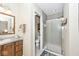 Bathroom featuring a vanity with mirror and a tiled shower at 5240 Windridge Dr, Indianapolis, IN 46226