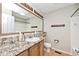 Bathroom features a light colored vanity with granite countertop and a large mirror at 5240 Windridge Dr, Indianapolis, IN 46226