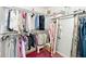 Closet featuring clothes hanging on racks and a mirror at 5240 Windridge Dr, Indianapolis, IN 46226
