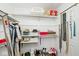 Walk-in closet with shelves and shoe racks at 5240 Windridge Dr, Indianapolis, IN 46226