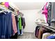 Walk-in closet with ample storage space and organized shelving and hanging rods for clothes at 5240 Windridge Dr, Indianapolis, IN 46226