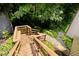 Elevated wooden deck with stairs leading down to the garden, perfect for outdoor enjoyment at 5240 Windridge Dr, Indianapolis, IN 46226