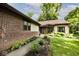 A charming single Gathering home with brick and siding, surrounded by lush landscaping and a walkway to the entrance at 5240 Windridge Dr, Indianapolis, IN 46226