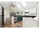 Bright kitchen with skylights, granite countertops, stainless steel appliances, and ample storage at 5240 Windridge Dr, Indianapolis, IN 46226