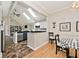 Stylish kitchen with skylights, granite countertops, white cabinets, and open to the dining area at 5240 Windridge Dr, Indianapolis, IN 46226