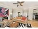 Cozy living room with hardwood floors, neutral decor, and ample seating at 5240 Windridge Dr, Indianapolis, IN 46226