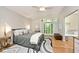Main bedroom boasting a large window allowing for natural lighting at 5240 Windridge Dr, Indianapolis, IN 46226