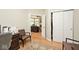 Office space with hardwood floors and natural light, featuring a closet at 5240 Windridge Dr, Indianapolis, IN 46226