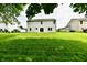 Spacious backyard with lush green grass, perfect for outdoor activities and entertaining at 5759 Columbia S Cir, Greenwood, IN 46142