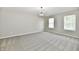 Spacious bedroom with carpet, natural light from windows, and modern light fixture at 5759 Columbia S Cir, Greenwood, IN 46142