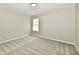 Neutral bedroom with plush gray carpeting, a window, and a clean, minimalist design at 5759 Columbia S Cir, Greenwood, IN 46142