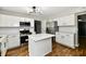 Spacious kitchen with white cabinets, stainless steel appliances, and a center island for meal preparation at 5759 Columbia S Cir, Greenwood, IN 46142