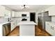 Bright kitchen with stainless steel appliances, white cabinets, and quartz countertops at 5759 Columbia S Cir, Greenwood, IN 46142