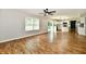 Open living room showcases hardwood floors, sliding door, and flows into the bright kitchen at 5759 Columbia S Cir, Greenwood, IN 46142