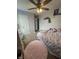 Bedroom offers carpeted floors, a ceiling fan, and ample closet space for comfortable living and storage at 6027 Moonseed Cir, Indianapolis, IN 46203