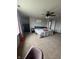 Cozy bedroom with a ceiling fan, carpeted floors, and a comfy bed, illuminated by natural light at 6027 Moonseed Cir, Indianapolis, IN 46203
