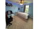 Comfortable bedroom with carpeted floor, fan, and natural light from a window at 6027 Moonseed Cir, Indianapolis, IN 46203