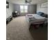 Comfortable bedroom features carpeted flooring and a ceiling fan for relaxation; well-lit by a window at 6027 Moonseed Cir, Indianapolis, IN 46203