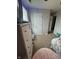 Bedroom with neutral colors, carpeted floor, and a walk-in closet; perfect for relaxation and storage at 6027 Moonseed Cir, Indianapolis, IN 46203