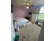 Bedroom featuring a ceiling fan, carpeted floor, and ample closet space for easy organization and comfort at 6027 Moonseed Cir, Indianapolis, IN 46203