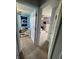 View of two bedrooms connected by carpeted floors and open doors at 6027 Moonseed Cir, Indianapolis, IN 46203