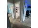 View of two bedrooms connected by a carpeted floor and doors at 6027 Moonseed Cir, Indianapolis, IN 46203