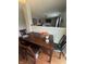 Cozy dining area with hardwood floors is open to the living area at 6027 Moonseed Cir, Indianapolis, IN 46203