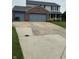This home features a wide driveway and attached two car garage at 6027 Moonseed Cir, Indianapolis, IN 46203