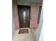Close-up of the decorative front door and welcome mat at 6027 Moonseed Cir, Indianapolis, IN 46203