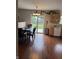 Kitchen with wooden cabinets and hardwood floors, leading to an outdoor view at 6027 Moonseed Cir, Indianapolis, IN 46203