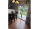 Bright kitchen with an adjacent dining area and a sliding door to the backyard at 6027 Moonseed Cir, Indianapolis, IN 46203