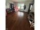 View of front room with beautiful hard wood floors and lots of natural light at 6027 Moonseed Cir, Indianapolis, IN 46203