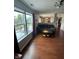 Living room with hardwood floors and view of fenced in backyard at 6027 Moonseed Cir, Indianapolis, IN 46203