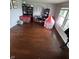 Hardwood floor in this living room provides ample space for play and customization with bright natural light at 6027 Moonseed Cir, Indianapolis, IN 46203