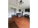 Living room featuring hardwood floors, neutral paint, and modern entertainment setup at 6027 Moonseed Cir, Indianapolis, IN 46203