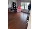 Spacious living room featuring hardwood floors, large windows and natural light at 6027 Moonseed Cir, Indianapolis, IN 46203