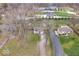 Aerial view of a home with a large front yard, and driveway at 6120 E Southport Rd, Indianapolis, IN 46237